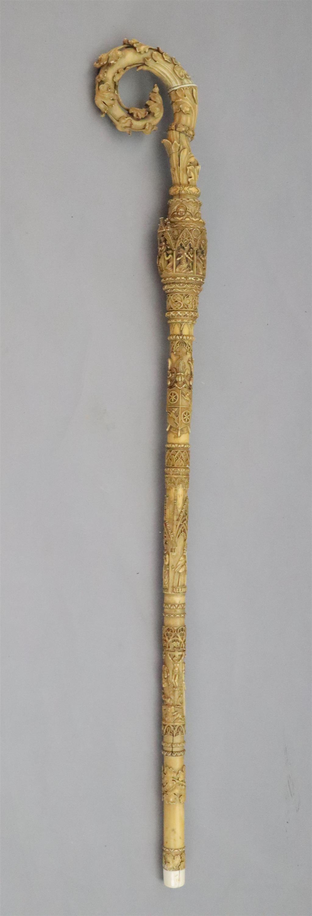 A 19th century Dieppe carved ivory crozier, thought to be a copy of a 13th century example, length 46in.